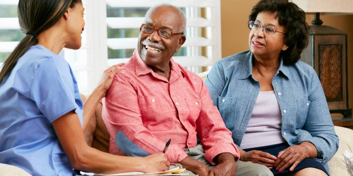 Caring home health aide helping senior in Lakewood Colorado